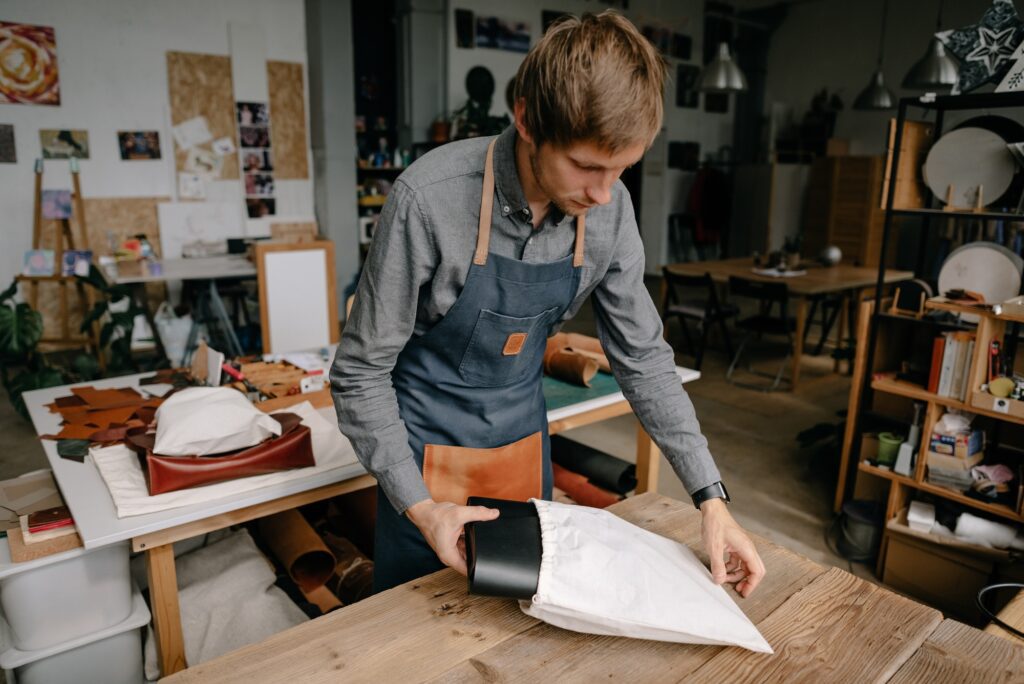 Small business, a man packs a product